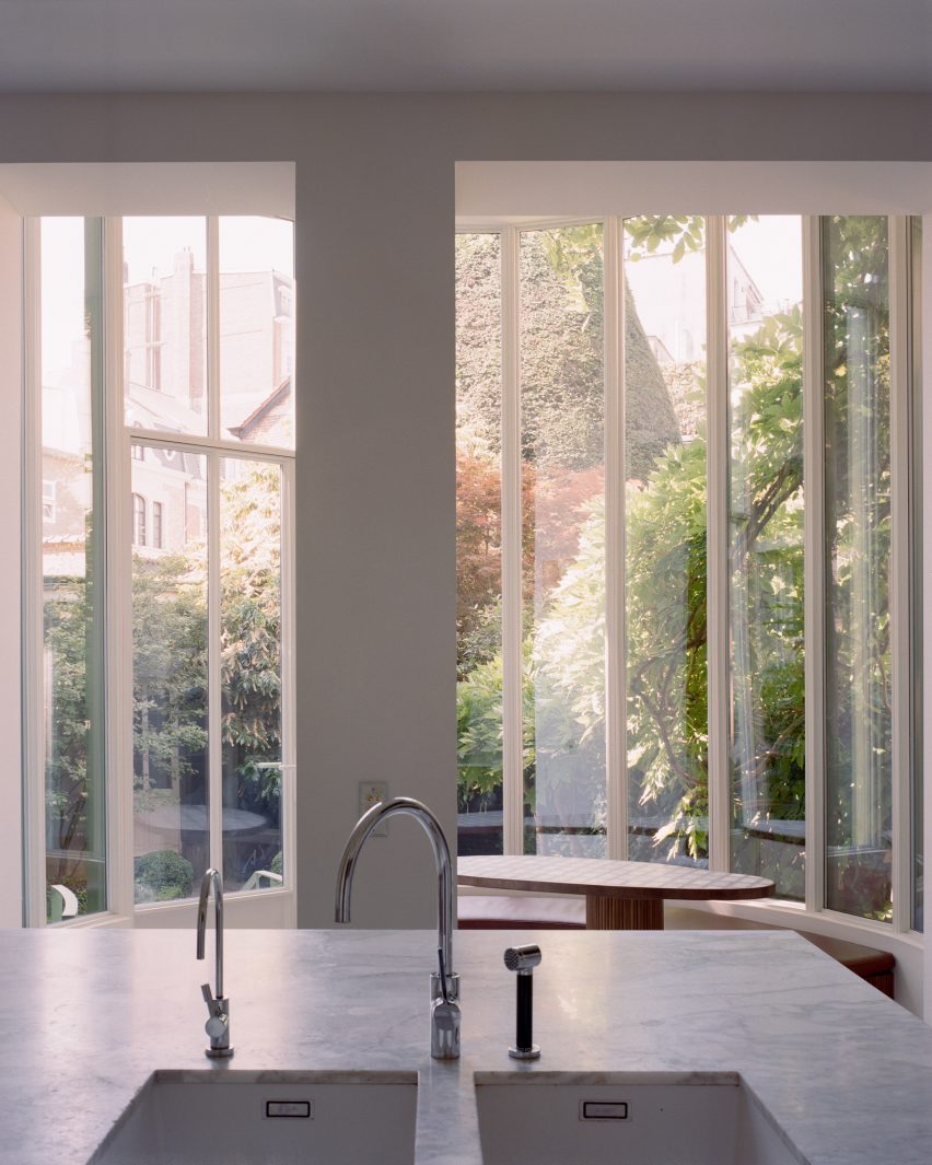 View of townhouse extension from adjacent kitchen in Brussels